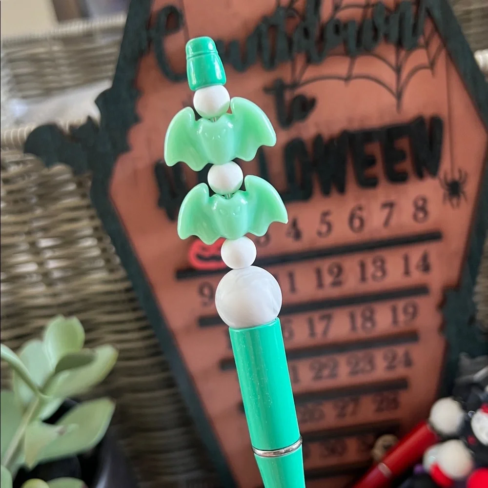 Green and Silver Decorative Pen